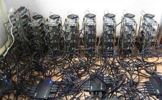 Close-up of a cryptocurrency mining rig illuminated with LED lights